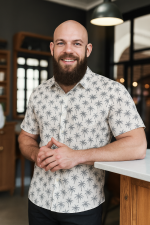 Men’s tropical white short-sleeve shirt with palm tree print, relaxed fit, perfect for summer or beachwear and cruise vacation.